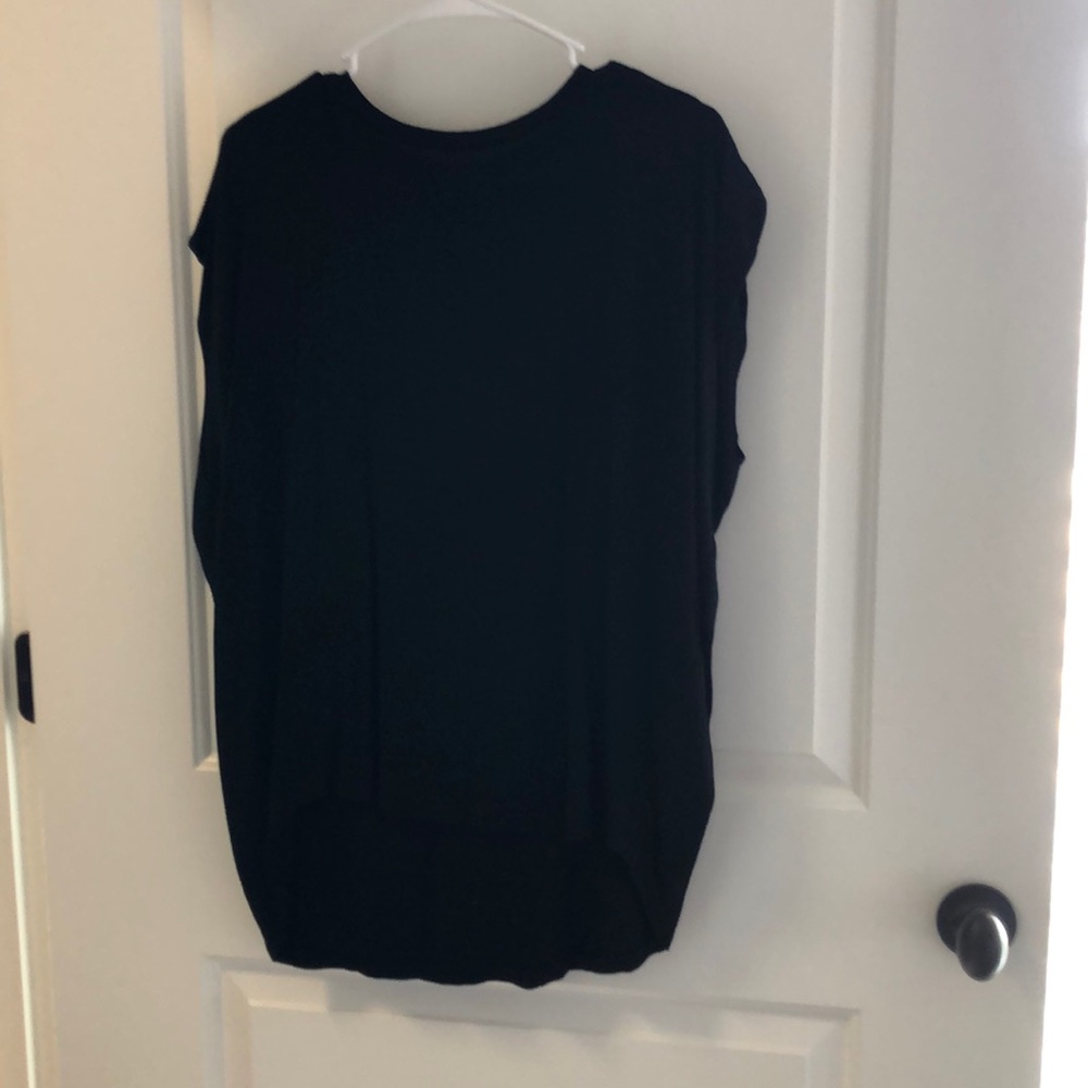 Black top. Sleeveless.
